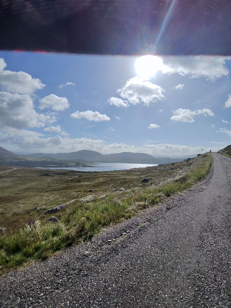 Highland loch and road on The Bà Sportive route